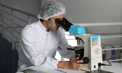 man sight on white microscope